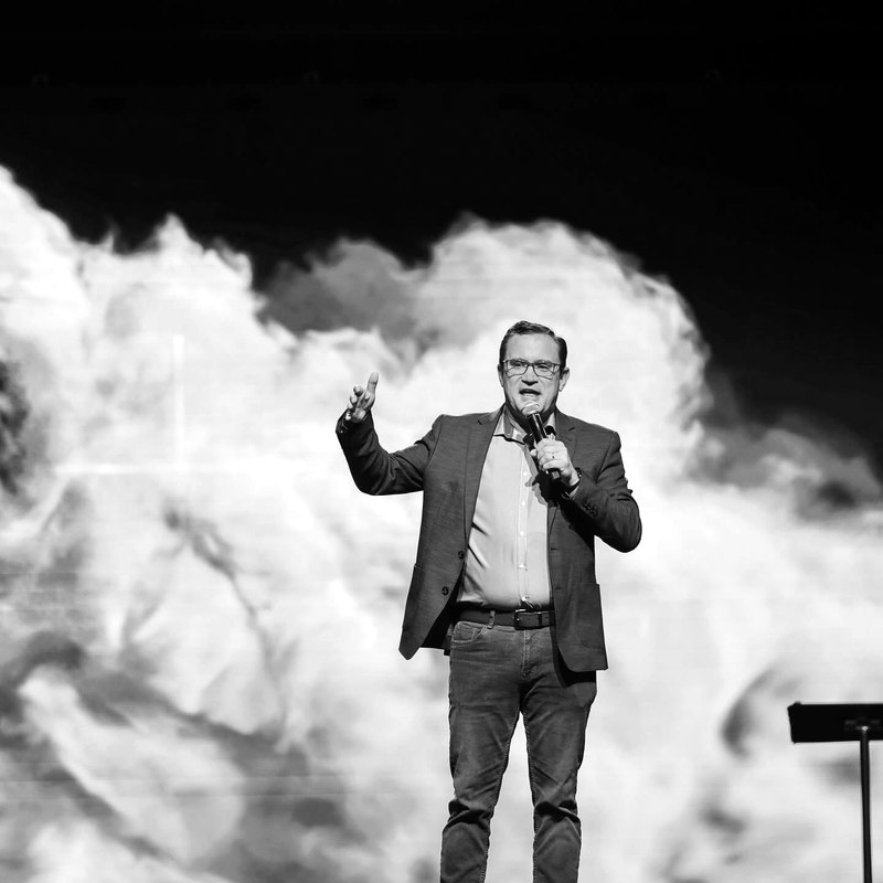 Mike Holt speaking on stage